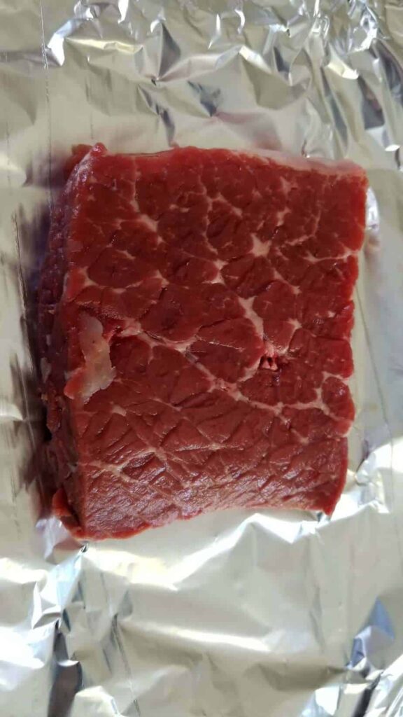 A rare piece of steak on foil