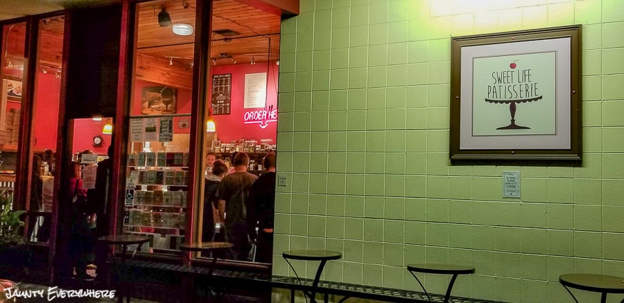 Facade of Sweet Life Patisserie in Eugene, OR. People in line through the front window.