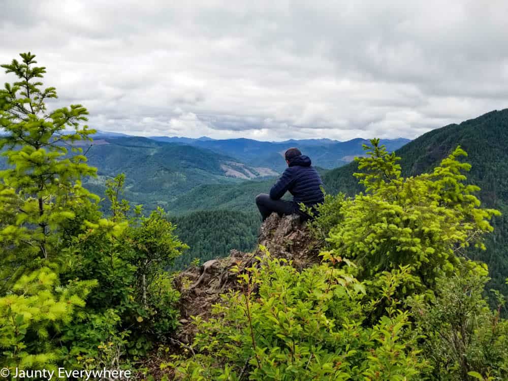 View from Kings Mountain, man sitting on the edge looking out.