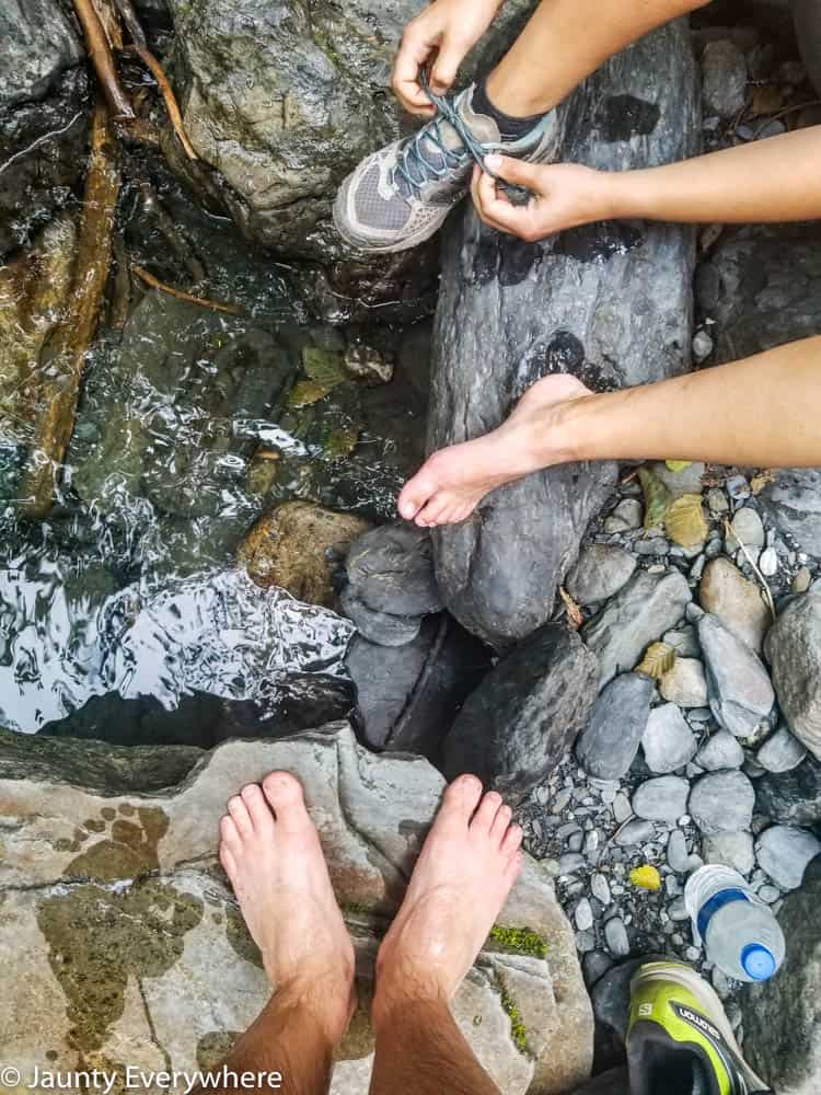 cooling tired hiking feet in a creek 