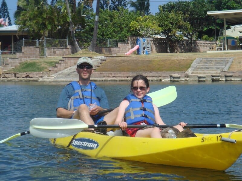 a father and daughter in a yellow kayak in hawaii, enneagram two togetherness