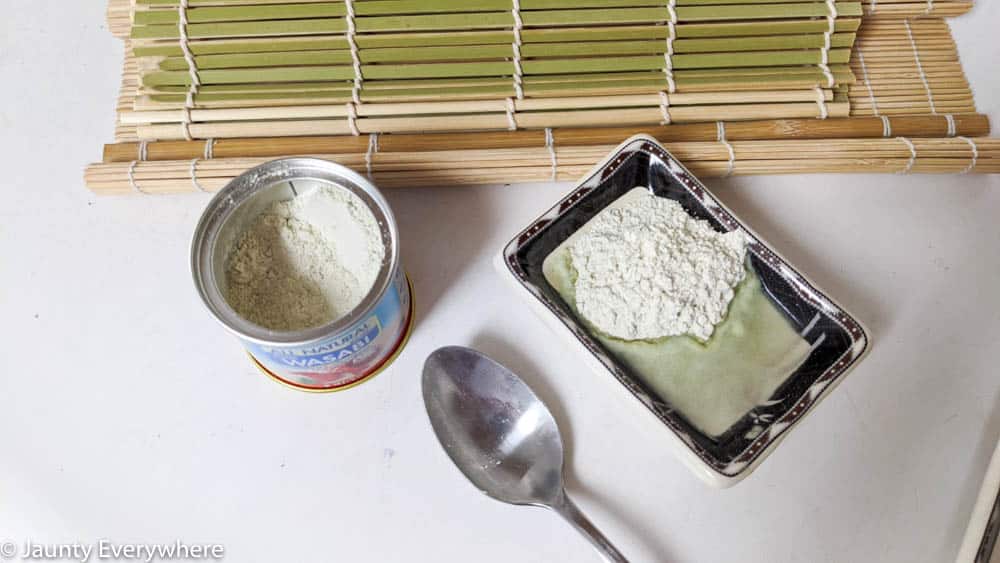 Making wasabi paste from wasabi powder by adding water. 