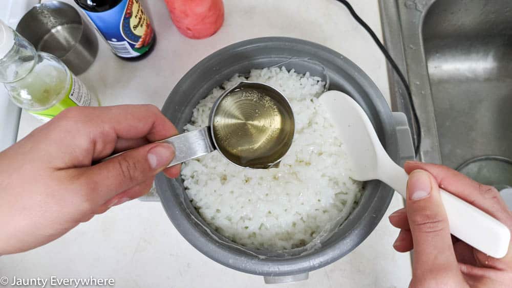Rice vinegar poured over sushi rice. 