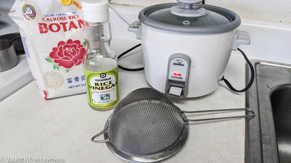Cooking sushi rice in a rice cooker.