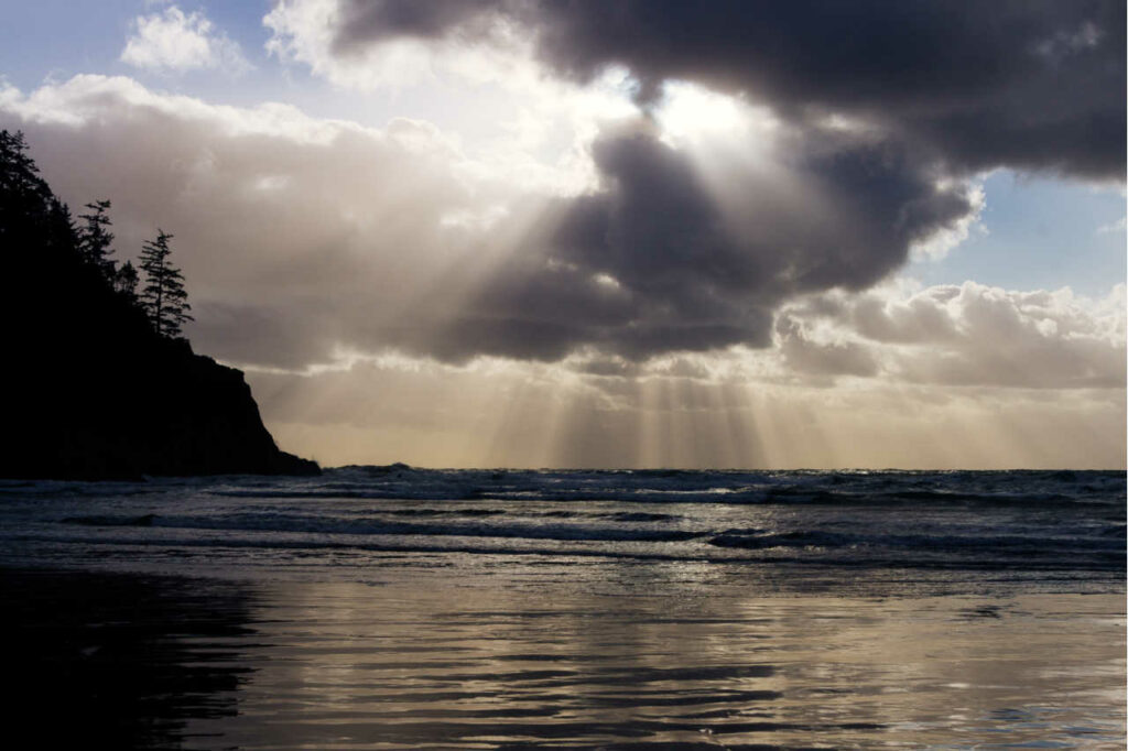 Sunlight filtering through the clouds at Short Sand Beach on the Oregon Coast