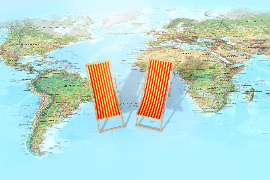 red and yellow striped lounge chairs sitting on a world map