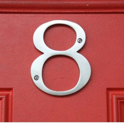 Silver letter eight on a red door