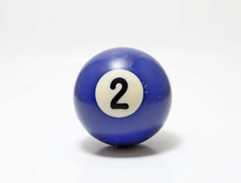 blue cue ball with the numeral two on a white background