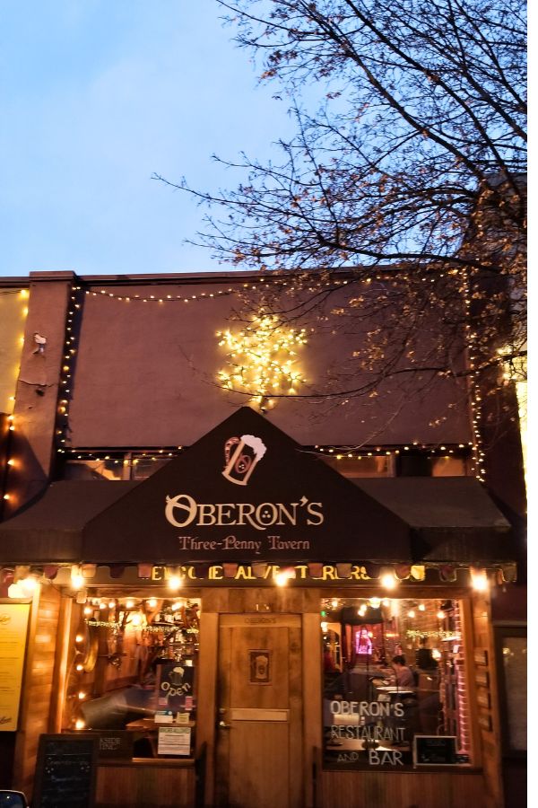 Oberon's Three-Penny Tavern front lit up for Christmas in Ashland, Oregon