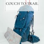 blue teal daypack with hiking sticks poking out and a folded map leaning against the front