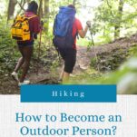 2 women hiking in the forest, they are wearing daypacks and using walking poles