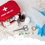 red first aid kit spilling out on a white background
