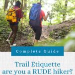 2 women on the trail with daypacks and using hiking poles