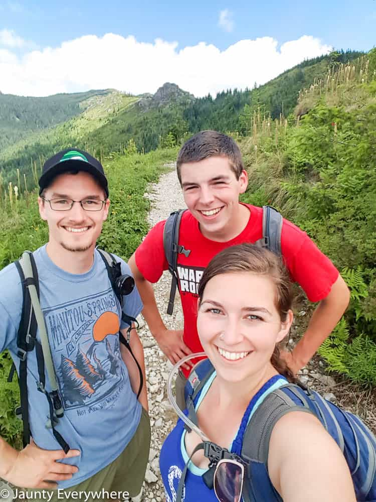A man, a teenager and a woman hiking on the trail of Silver Star Mountain outside of Washougal Washington